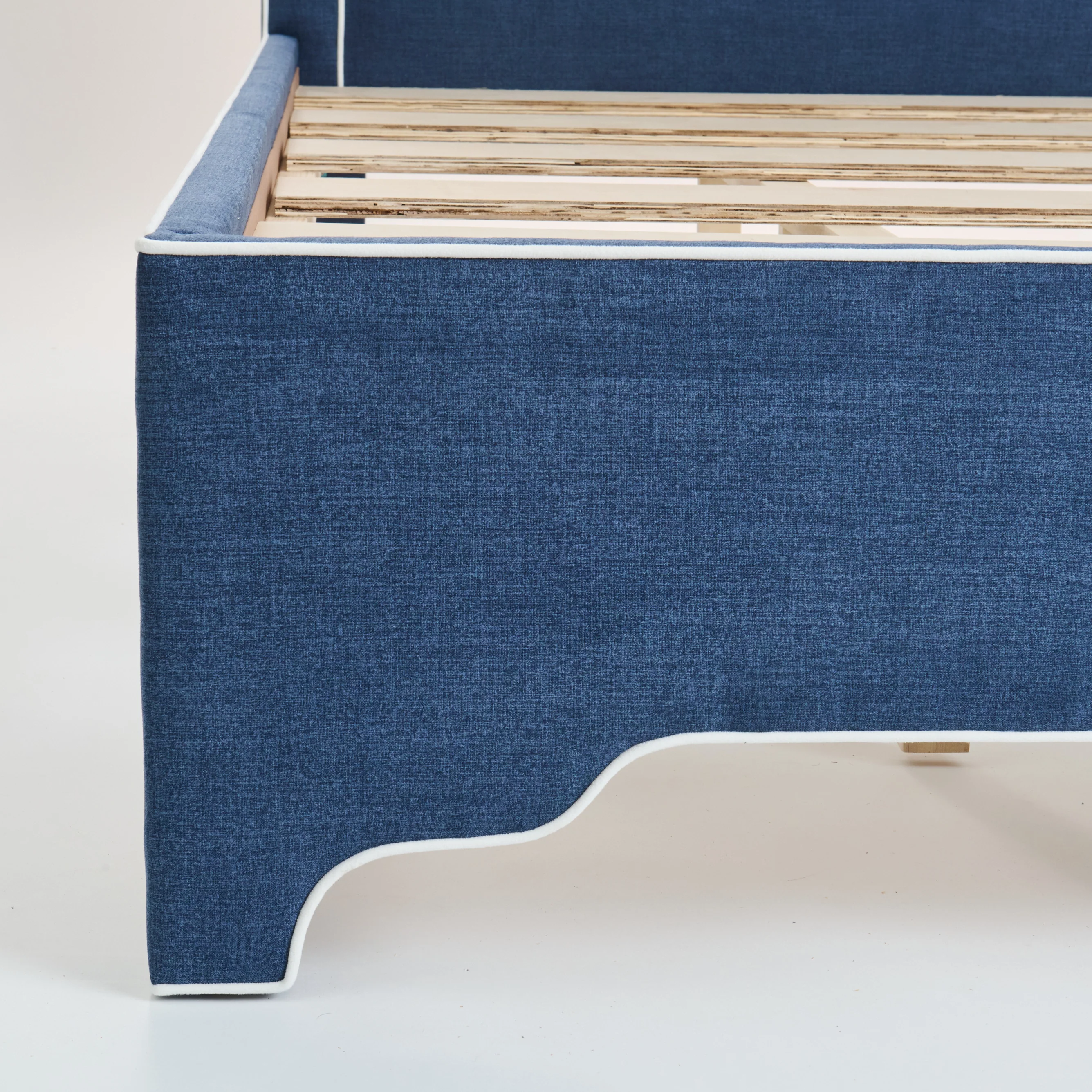 65"H King Upholstered Platform Bed - Scalloped Legs - Navy Woven Fabric with White Trim - Image 5